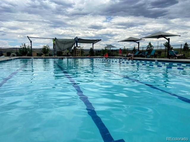 community pool with fence