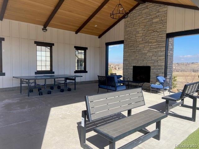 view of patio / terrace featuring an outdoor stone fireplace