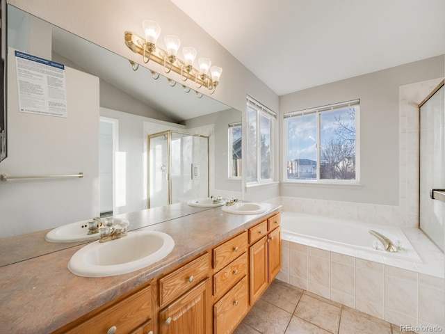 bathroom with lofted ceiling, shower with separate bathtub, tile patterned flooring, and vanity