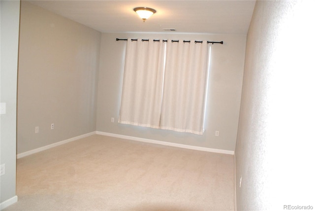 unfurnished room featuring carpet flooring