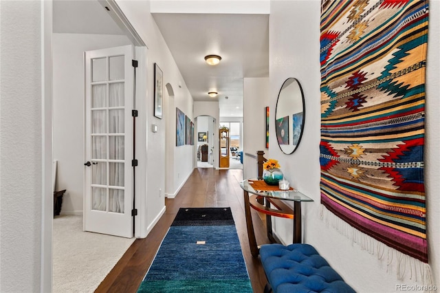 hallway with dark wood-type flooring