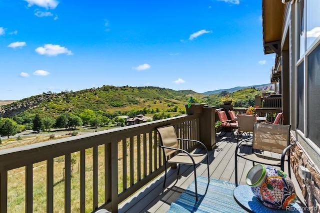 wooden deck featuring a mountain view