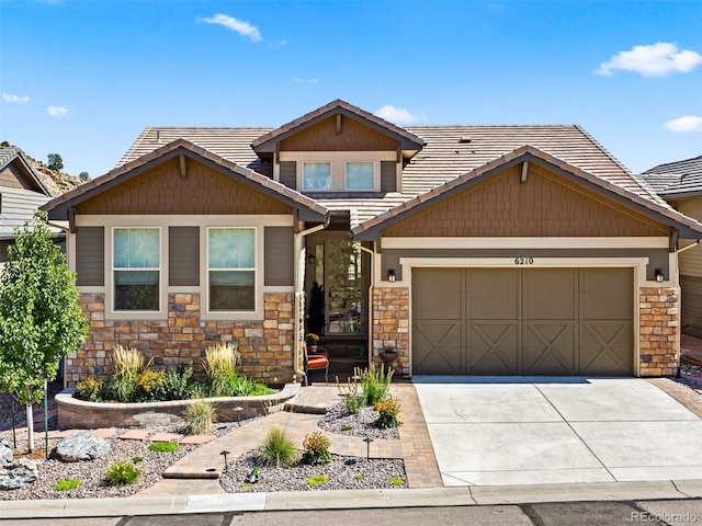 craftsman house with a garage