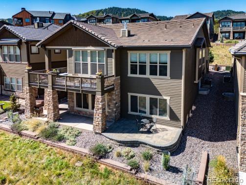 back of property with a patio area and a balcony