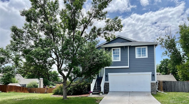 4178 E 94th Pl, Thornton, CO 80229 - view of front facade featuring a garage, driveway, stairway, and stone siding