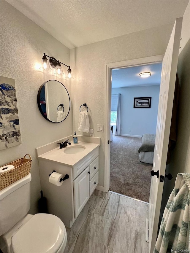 4178 E 94th Pl, Thornton, CO 80229 - bathroom featuring vanity, toilet, a textured wall, and a textured ceiling