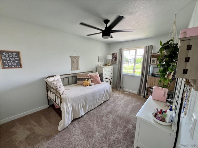 4178 E 94th Pl, Thornton, CO 80229 - bedroom with baseboards, light colored carpet, a ceiling fan, and a textured ceiling