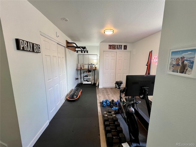 4178 E 94th Pl, Thornton, CO 80229 - workout room featuring baseboards and a textured ceiling