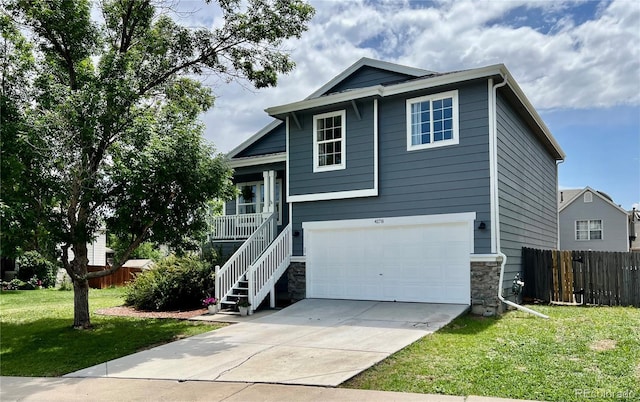 4178 E 94th Pl, Thornton, CO 80229 - view of front of property featuring a garage, stairs, covered porch, stone siding, and driveway