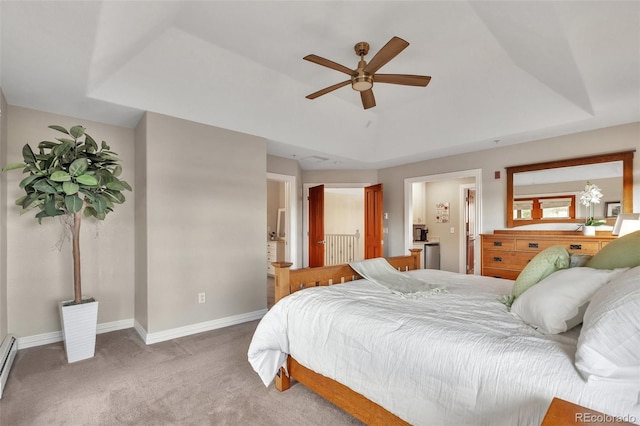 bedroom with baseboards, carpet flooring, a baseboard heating unit, and a ceiling fan