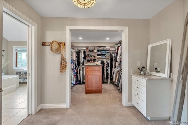 spacious closet featuring light carpet