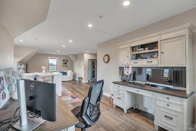 home office featuring attic access, light wood-type flooring, built in study area, recessed lighting, and baseboards