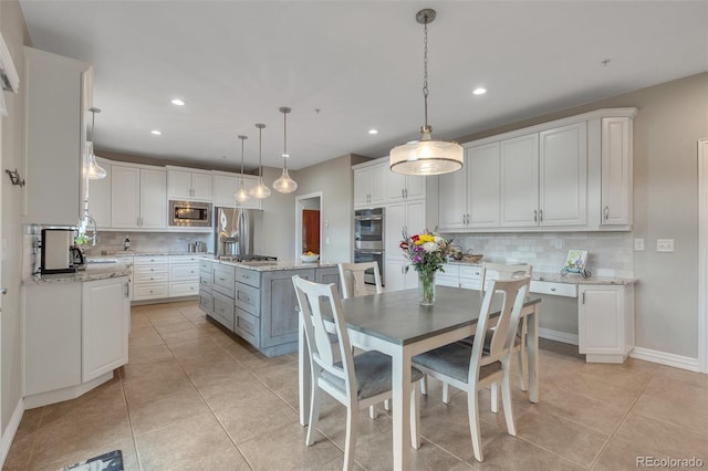 dining room featuring light tile patterned floors, recessed lighting, and baseboards