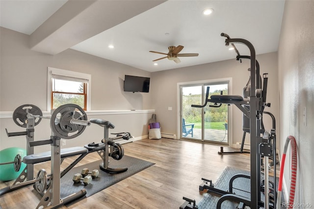 workout room with plenty of natural light, a baseboard heating unit, a ceiling fan, and recessed lighting