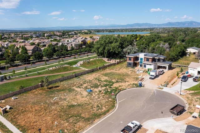 birds eye view of property featuring a mountain view