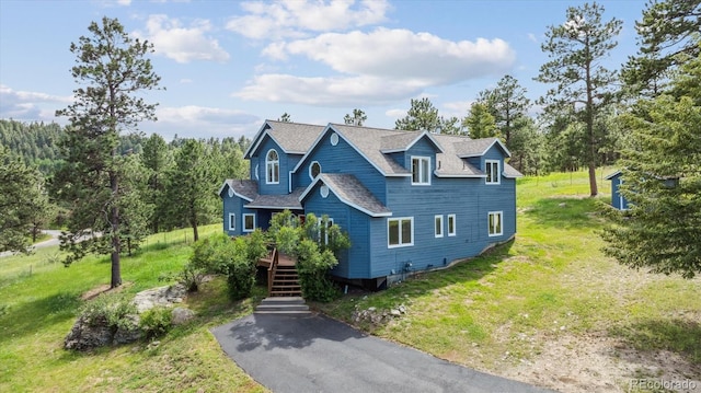 5939 S Skyline Dr, Evergreen, CO 80439 - view of front of property with a front yard, roof with shingles, and stairs
