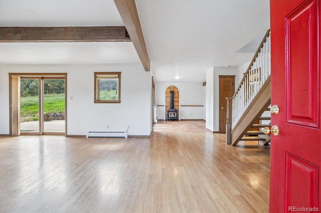 5939 S Skyline Dr, Evergreen, CO 80439 - foyer featuring baseboard heating, stairway, a wood stove, light wood-type flooring, and beamed ceiling