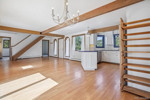 5939 S Skyline Dr, Evergreen, CO 80439 - unfurnished living room with a baseboard radiator, stairway, beamed ceiling, light wood-style flooring, and a chandelier