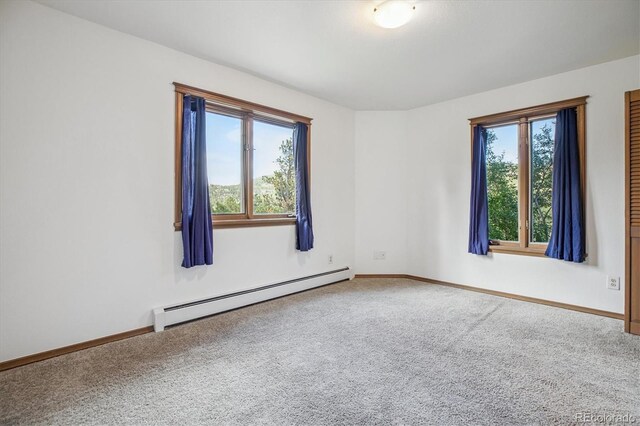 5939 S Skyline Dr, Evergreen, CO 80439 - carpeted empty room with a baseboard radiator and baseboards