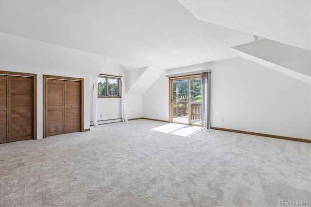 5939 S Skyline Dr, Evergreen, CO 80439 - additional living space with lofted ceiling, baseboard heating, and carpet