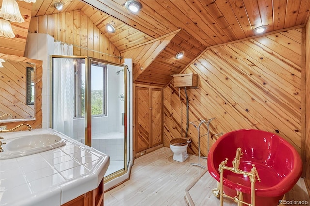 5939 S Skyline Dr, Evergreen, CO 80439 - bathroom featuring vaulted ceiling, wooden walls, wood finished floors, a stall shower, and wood ceiling