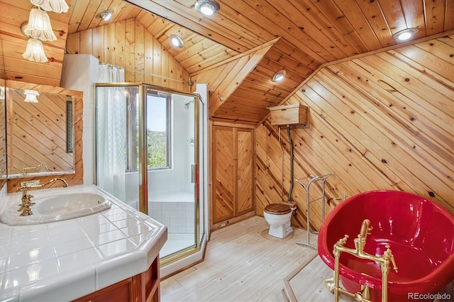 5939 S Skyline Dr, Evergreen, CO 80439 - full bath with vaulted ceiling, wooden walls, wood finished floors, a stall shower, and wood ceiling