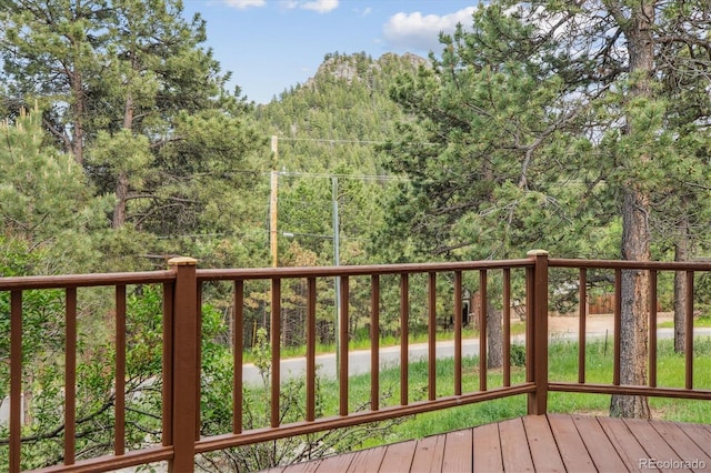 5939 S Skyline Dr, Evergreen, CO 80439 - wooden terrace with a view of trees