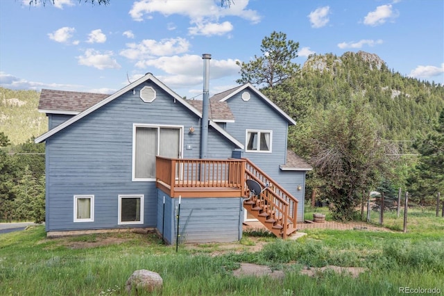 5939 S Skyline Dr, Evergreen, CO 80439 - rear view of house with stairway, a deck, and roof with shingles