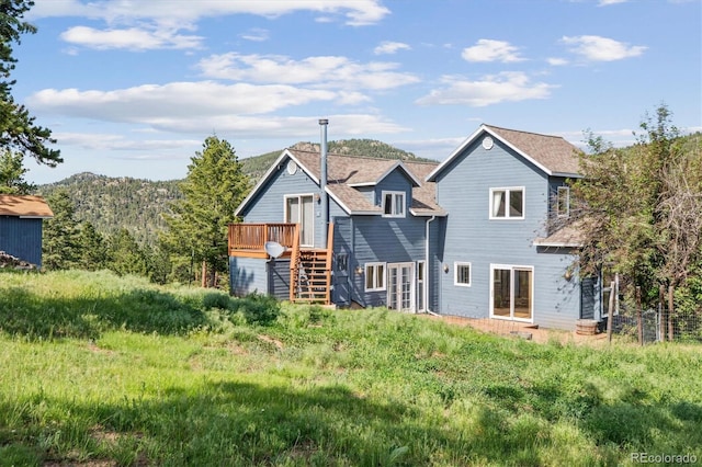 5939 S Skyline Dr, Evergreen, CO 80439 - rear view of property with stairs and a deck