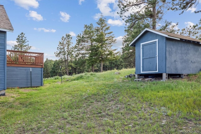 5939 S Skyline Dr, Evergreen, CO 80439 - view of yard featuring a storage unit and a wooden deck