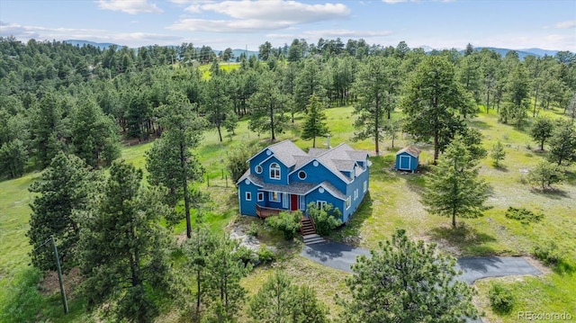 5939 S Skyline Dr, Evergreen, CO 80439 - view of subject property featuring a forest