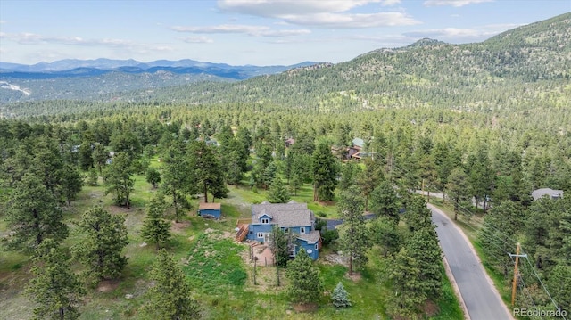 5939 S Skyline Dr, Evergreen, CO 80439 - drone / aerial view of a forest and mountains