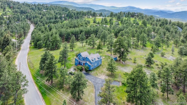 5939 S Skyline Dr, Evergreen, CO 80439 - view from above of property featuring a mountain backdrop and a forest