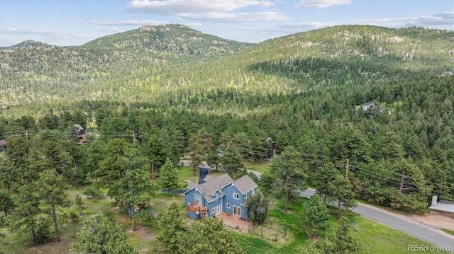 5939 S Skyline Dr, Evergreen, CO 80439 - aerial view of property and surrounding area featuring a forest and a mountainous background