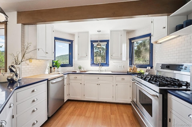 5939 S Skyline Dr, Evergreen, CO 80439 - kitchen featuring stainless steel appliances, decorative backsplash, light wood-style flooring, white cabinetry, and beam ceiling