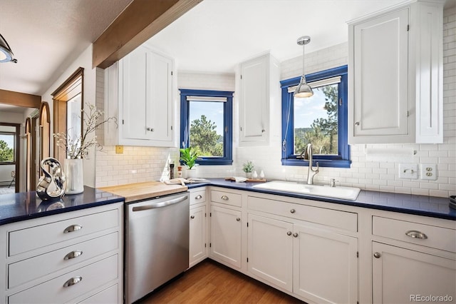 5939 S Skyline Dr, Evergreen, CO 80439 - kitchen featuring dishwasher, plenty of natural light, and decorative backsplash