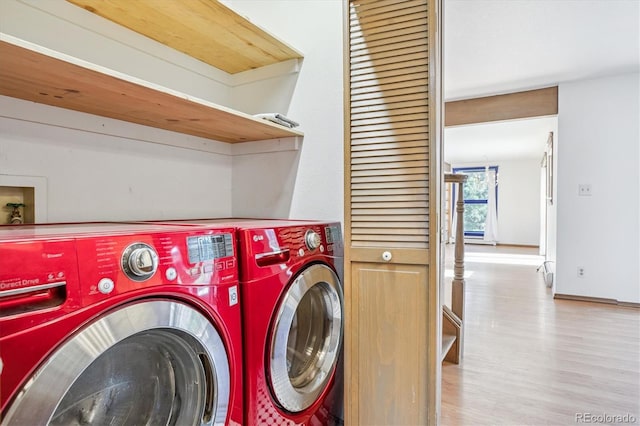 5939 S Skyline Dr, Evergreen, CO 80439 - laundry room with separate washer and dryer and wood finished floors