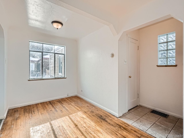 empty room with light wood-type flooring