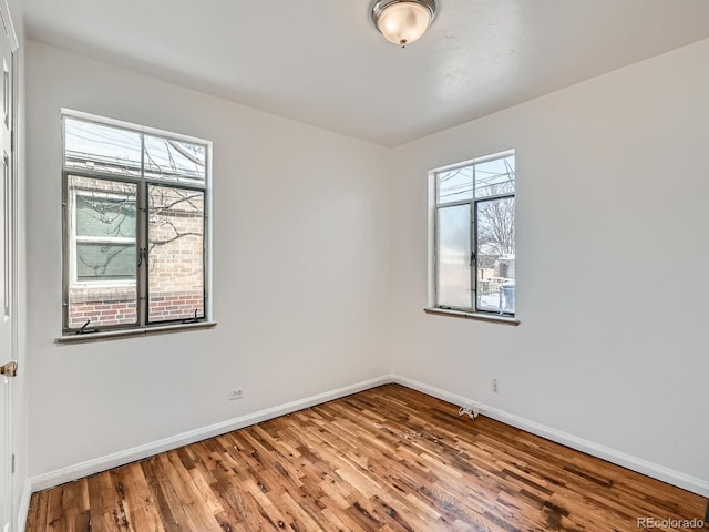 empty room featuring wood-type flooring