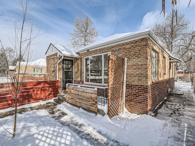 view of snow covered property