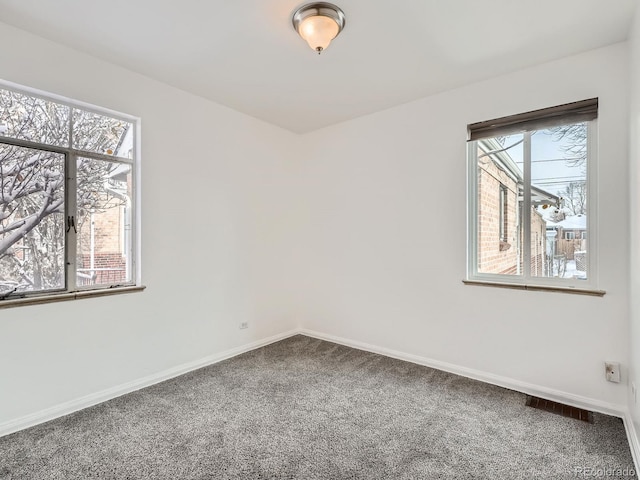 empty room with carpet flooring