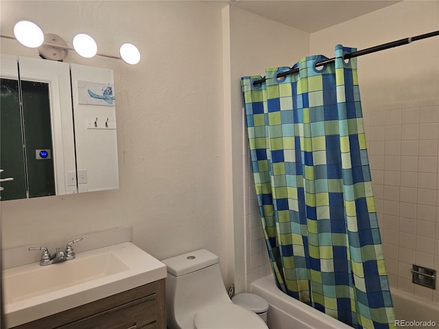 full bathroom featuring shower / tub combo, vanity, and toilet