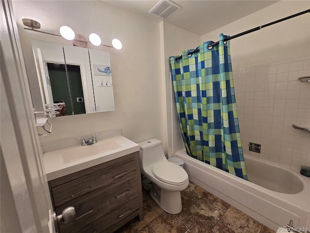 full bathroom with shower / tub combo with curtain, vanity, and toilet