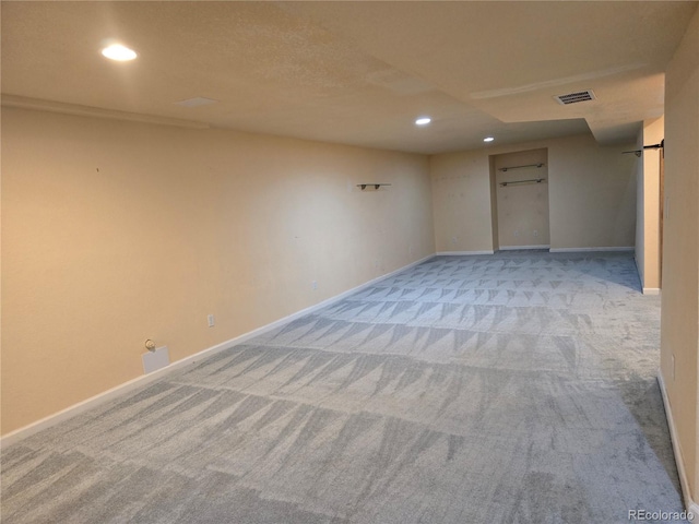 basement with light colored carpet