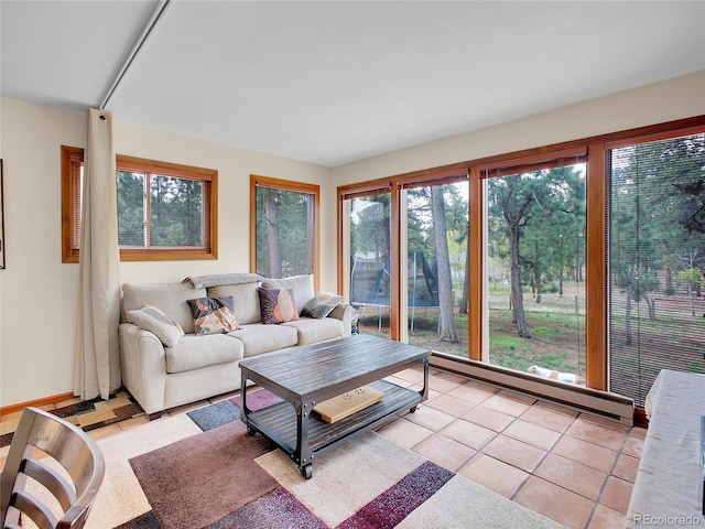 194 Tincup Ter, Bailey, CO 80421 - living area with a baseboard radiator and light tile patterned floors