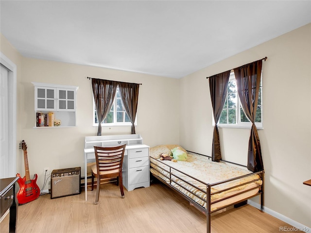 194 Tincup Ter, Bailey, CO 80421 - bedroom featuring light wood-type flooring and baseboards