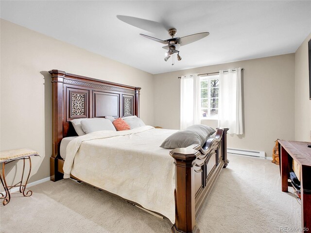 194 Tincup Ter, Bailey, CO 80421 - bedroom with light colored carpet, a baseboard heating unit, and ceiling fan