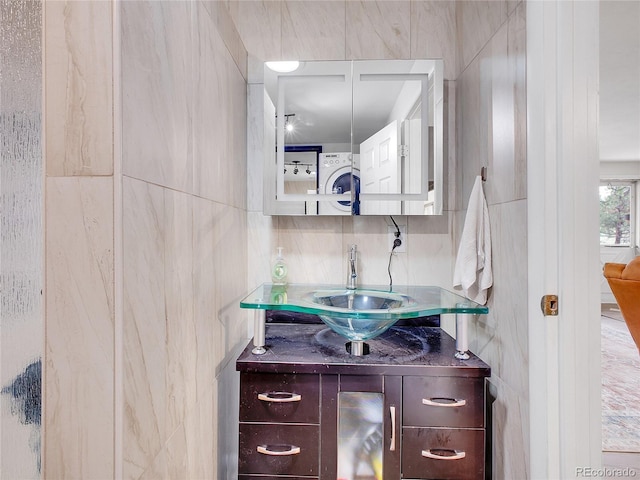 194 Tincup Ter, Bailey, CO 80421 - bathroom featuring vanity and stacked washer / drying machine
