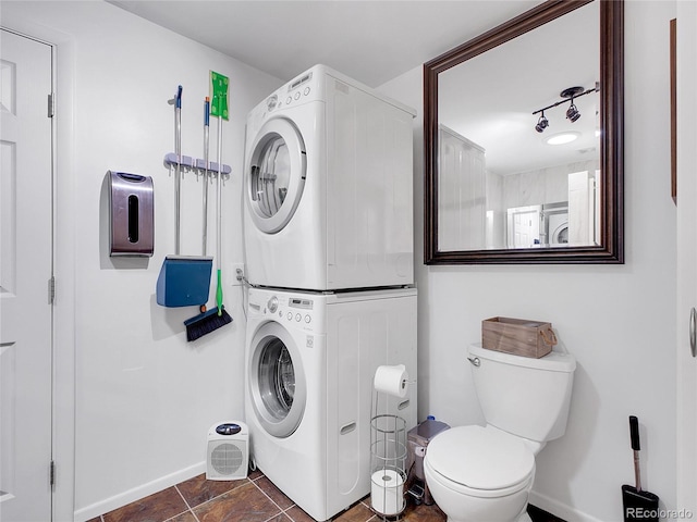 194 Tincup Ter, Bailey, CO 80421 - bathroom featuring estacked washer and dryer and baseboards