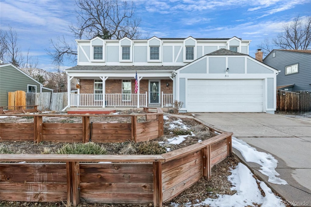 view of front of property with a garage and a porch